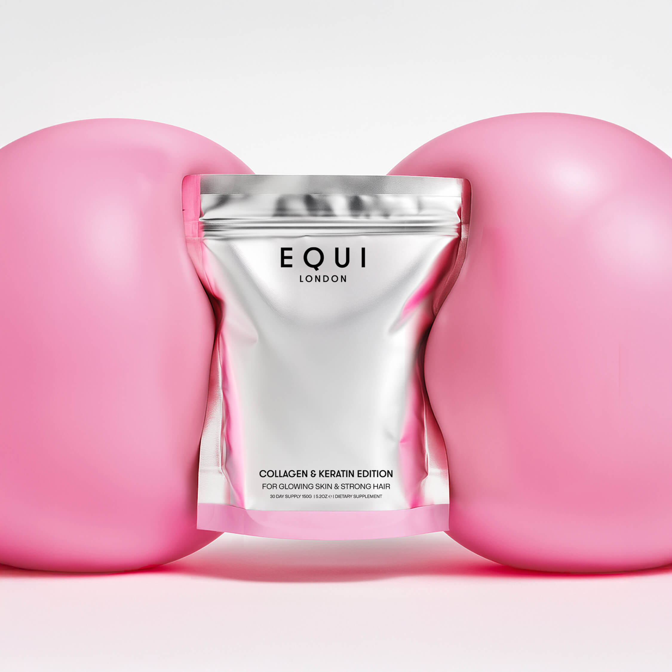 EQUI London Collagen & Keratin Edition between pink balloons on a white background
