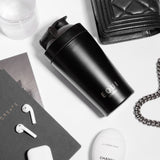  Equi Shaker with AirPods and a Chanel handbag 